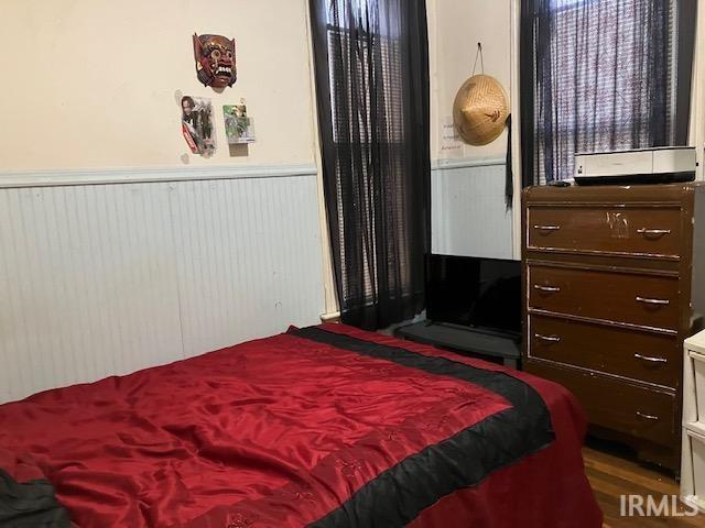 bedroom with hardwood / wood-style floors