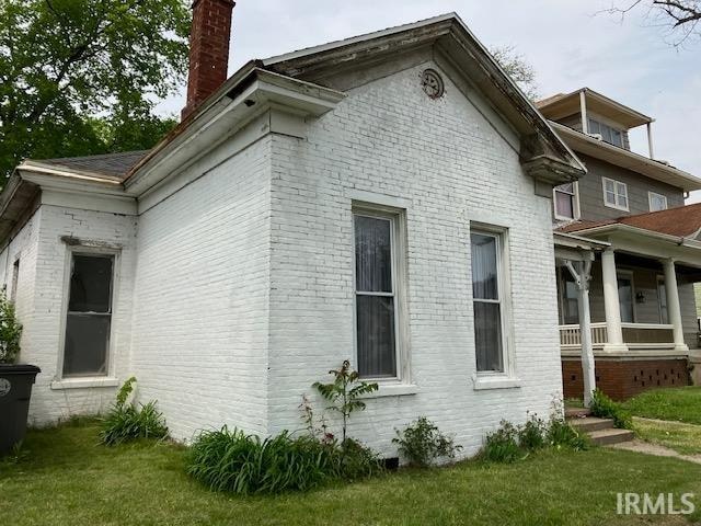 view of home's exterior featuring a yard