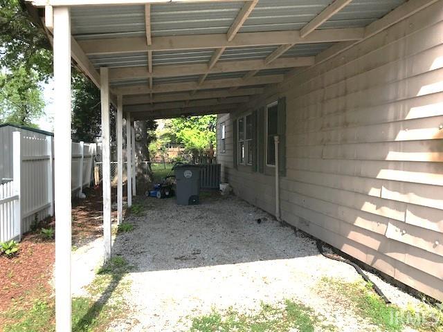 exterior space with a carport