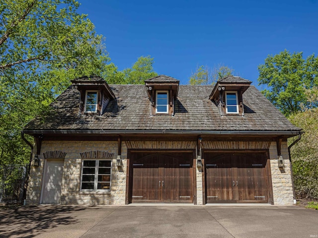 view of front of property with a garage