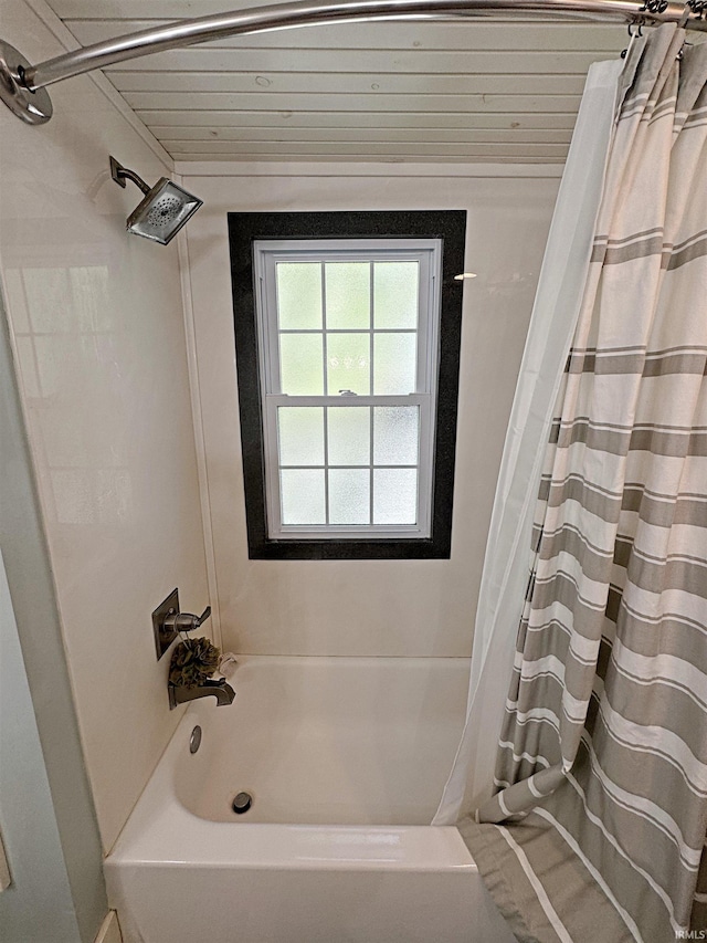 bathroom featuring shower / bath combo with shower curtain