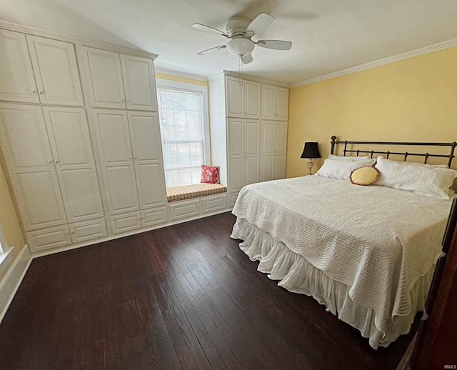 bedroom featuring ornamental molding, ceiling fan, and dark hardwood / wood-style floors