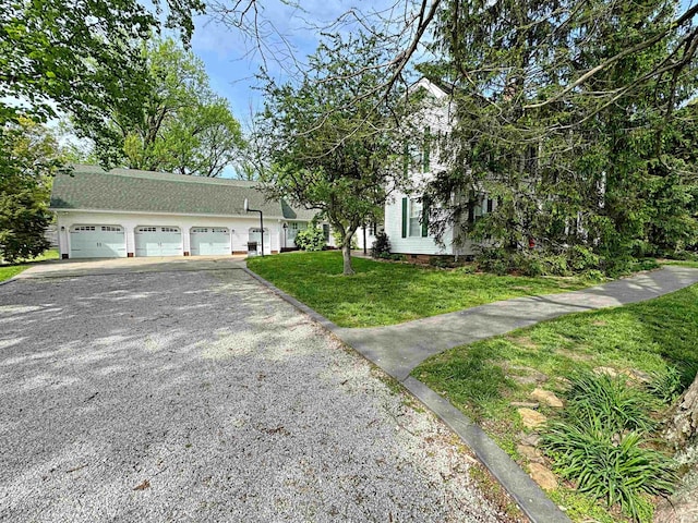 view of front of house with a garage and a front yard