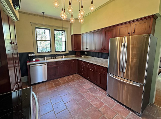 kitchen with tile flooring, appliances with stainless steel finishes, sink, backsplash, and pendant lighting