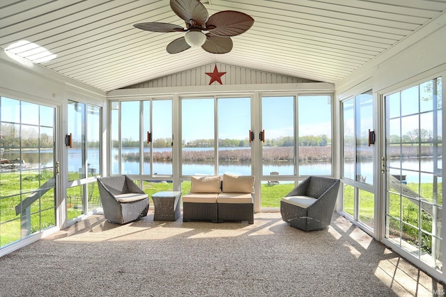 unfurnished sunroom with a wealth of natural light and a water view