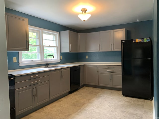 kitchen featuring gray cabinets, black appliances, and sink