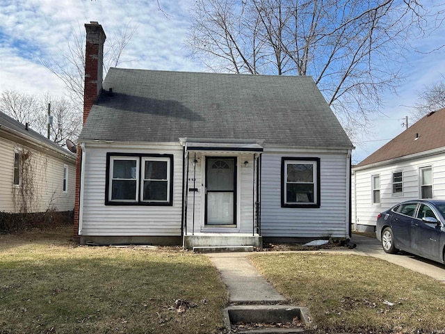 new england style home with a front yard