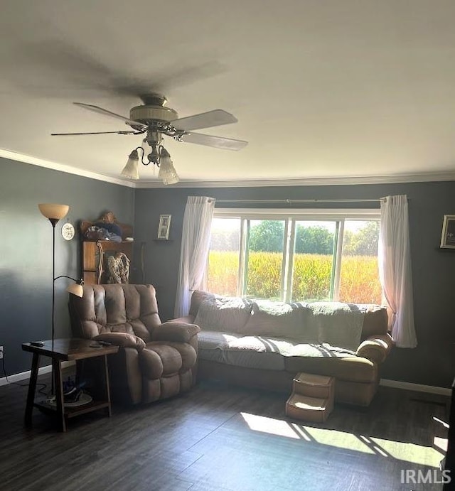 living room featuring hardwood / wood-style floors, ceiling fan, and ornamental molding