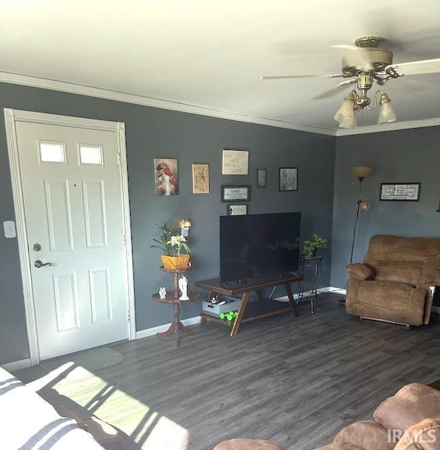 260 Lyons Ln, Heltonville, IN 47436 - living room featuring crown molding, dark wood-type flooring, and ceiling fan