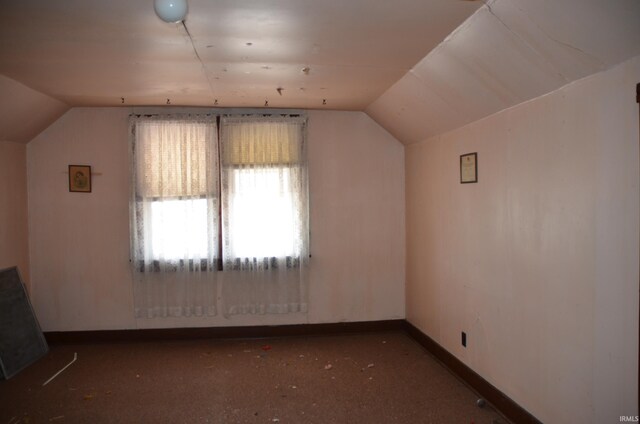 additional living space with lofted ceiling