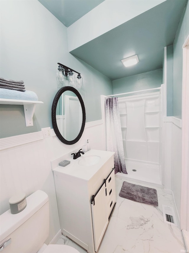 bathroom featuring curtained shower, large vanity, toilet, and tile flooring