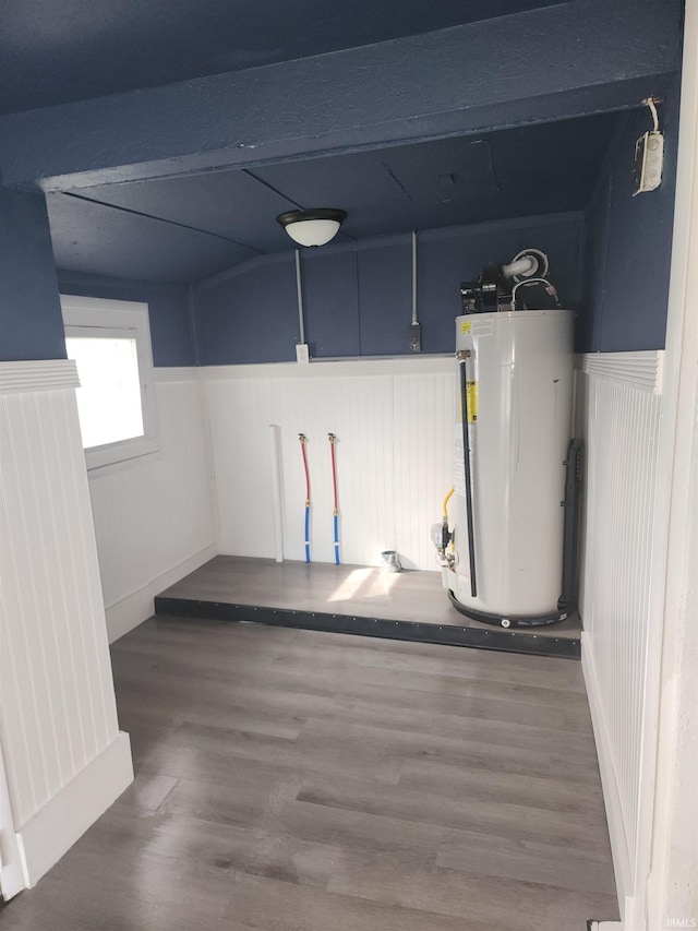 interior space with water heater and dark hardwood / wood-style floors