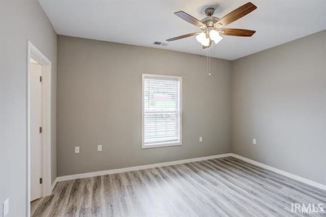 unfurnished room featuring light hardwood / wood-style floors and ceiling fan