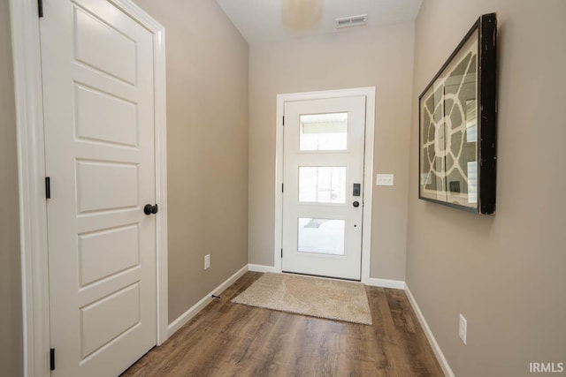 entryway with hardwood / wood-style flooring