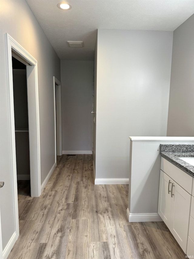 bathroom featuring vanity and hardwood / wood-style flooring