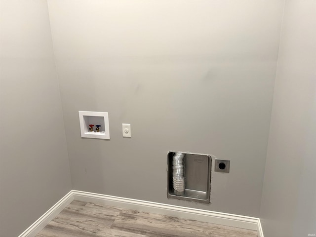 laundry room with electric dryer hookup, hardwood / wood-style floors, and washer hookup