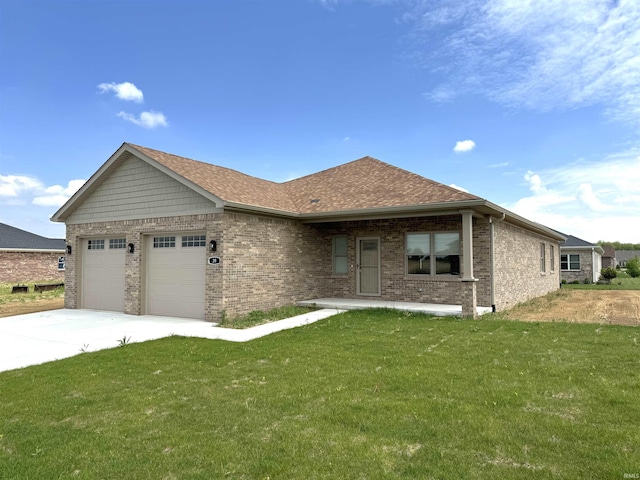 ranch-style home with a garage and a front lawn