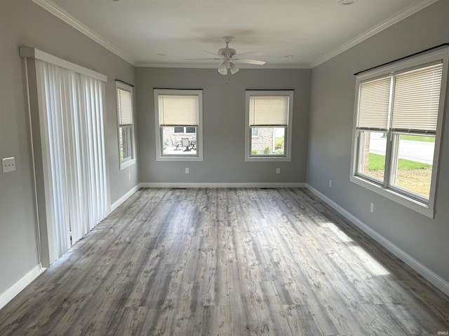 unfurnished room with hardwood / wood-style flooring, ornamental molding, and ceiling fan