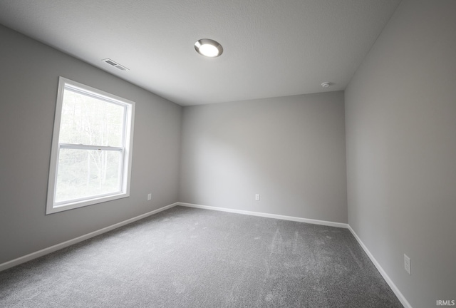 empty room with carpet flooring