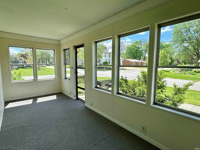 unfurnished sunroom featuring plenty of natural light