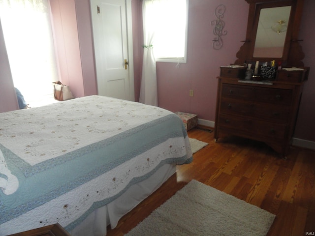 bedroom featuring dark hardwood / wood-style flooring