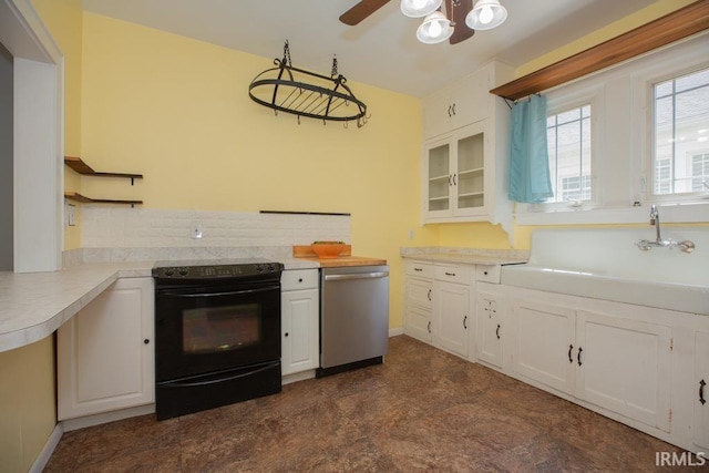 kitchen featuring stainless steel dishwasher, ceiling fan, white cabinetry, black electric range, and dark tile floors