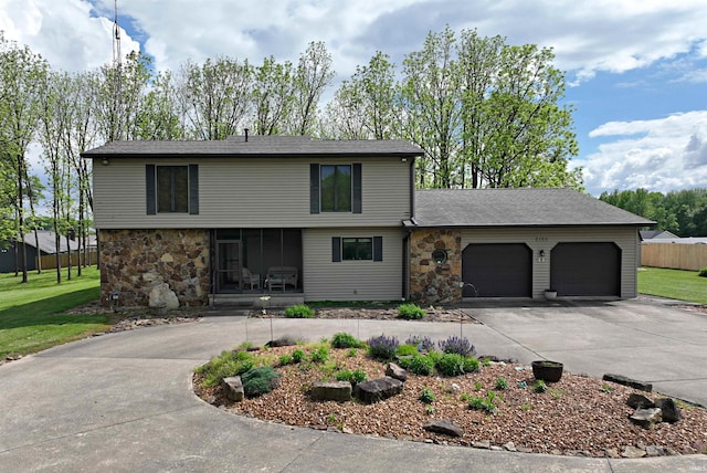 front facade featuring a garage and a front yard