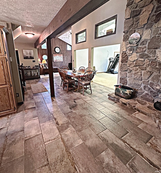 interior space with a textured ceiling and tile floors