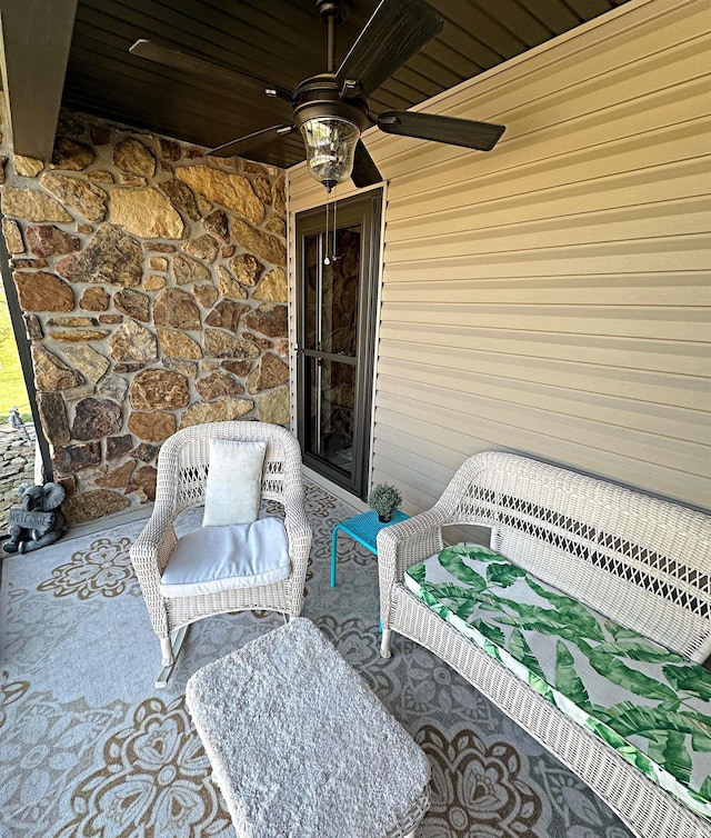 view of terrace featuring ceiling fan