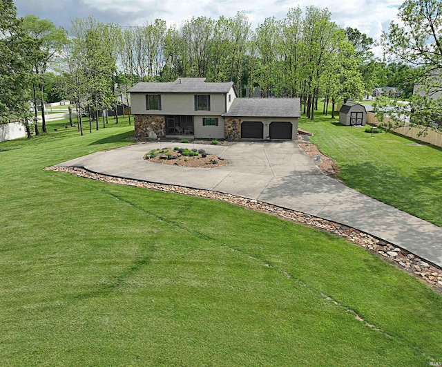 tri-level home with a front yard and a garage