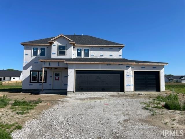 unfinished property featuring a garage