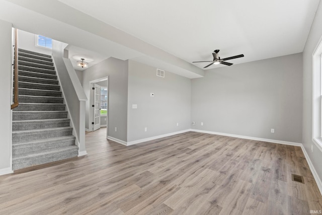 unfurnished room featuring hardwood / wood-style flooring and ceiling fan