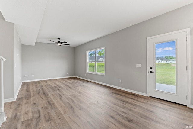 spare room with ceiling fan and light hardwood / wood-style floors