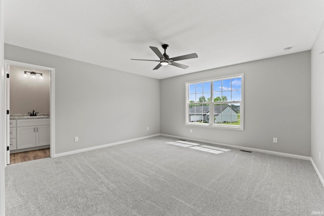 carpeted empty room with ceiling fan