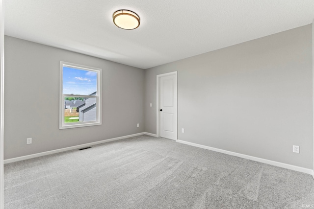 empty room featuring carpet flooring