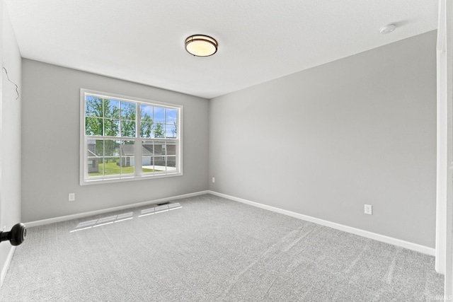 unfurnished room with carpet