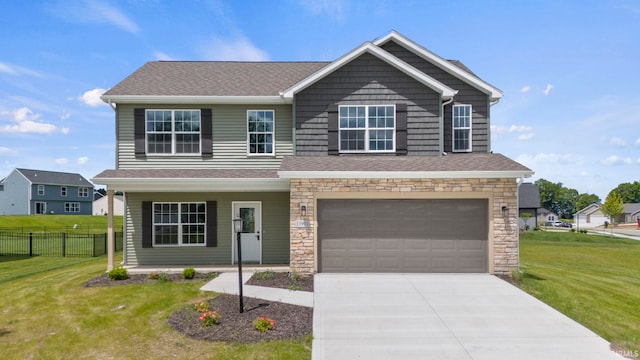 view of front of property with a garage and a front yard