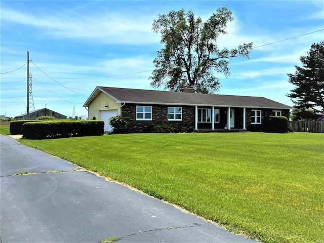 single story home with a garage and a front yard