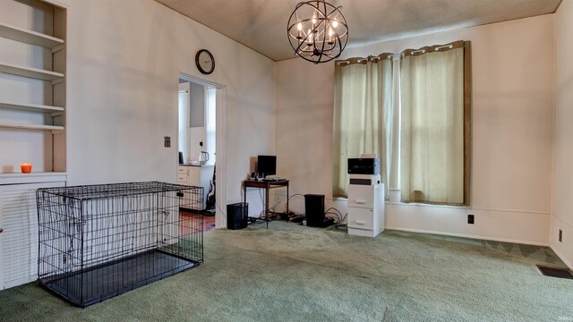 interior space featuring a notable chandelier and dark carpet