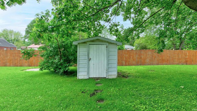 view of shed / structure with a lawn