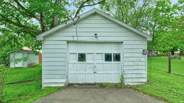 view of outdoor structure featuring a lawn