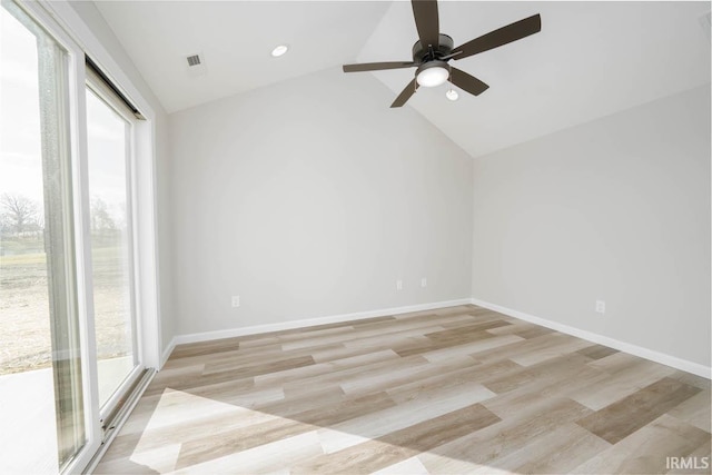 unfurnished room featuring ceiling fan, lofted ceiling, and light hardwood / wood-style floors