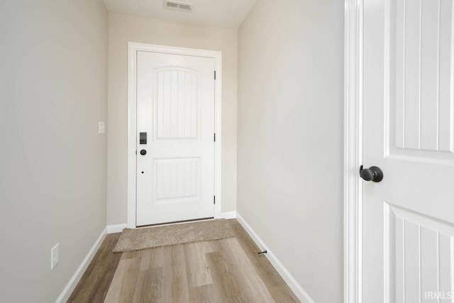 doorway to outside featuring light wood-type flooring