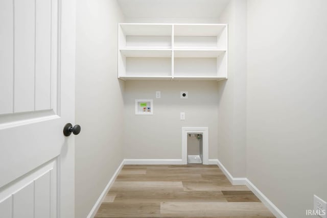 laundry room with light hardwood / wood-style flooring, hookup for an electric dryer, and washer hookup