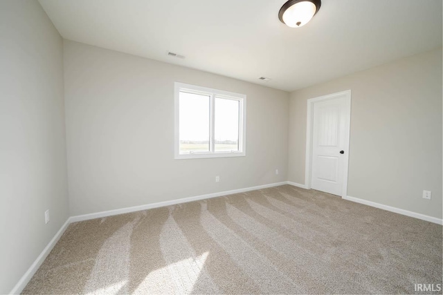 empty room with carpet flooring