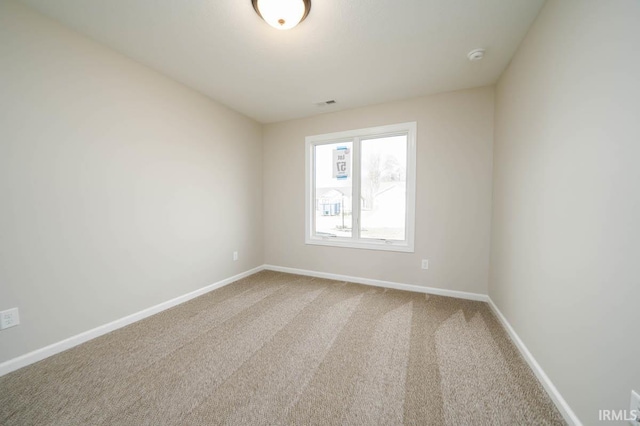 spare room featuring carpet flooring