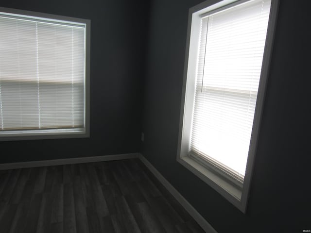 empty room featuring dark hardwood / wood-style floors