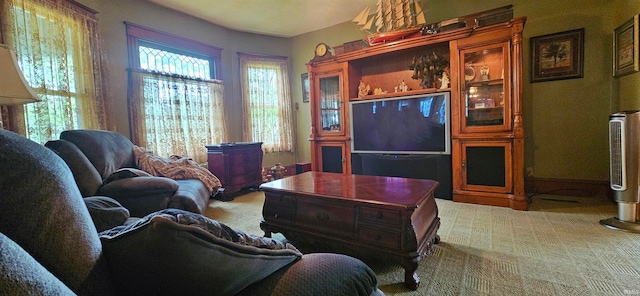 living room with plenty of natural light and carpet