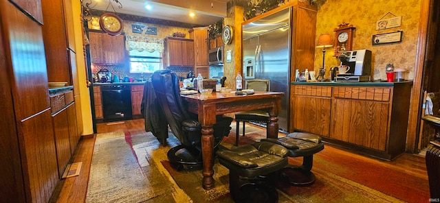 kitchen with stainless steel appliances and dark wood-type flooring