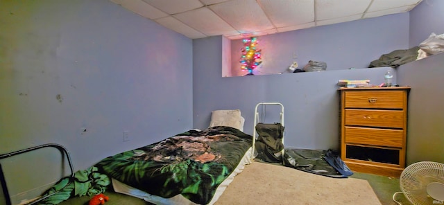 bedroom featuring a paneled ceiling